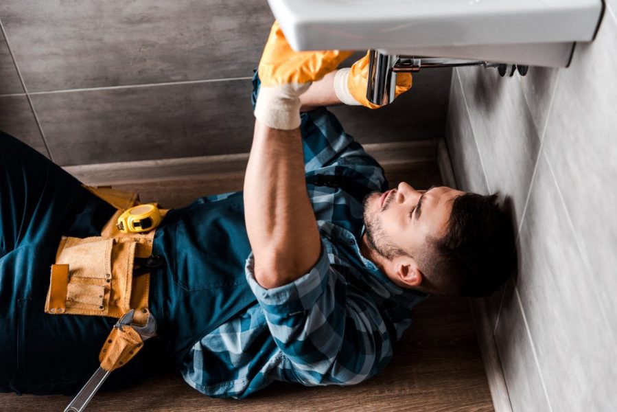 selective-focus-of-repairman-fixing-water-damage-in-bathroom.jpg